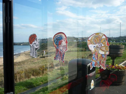 Stickers of skills stuck onto bus shelter